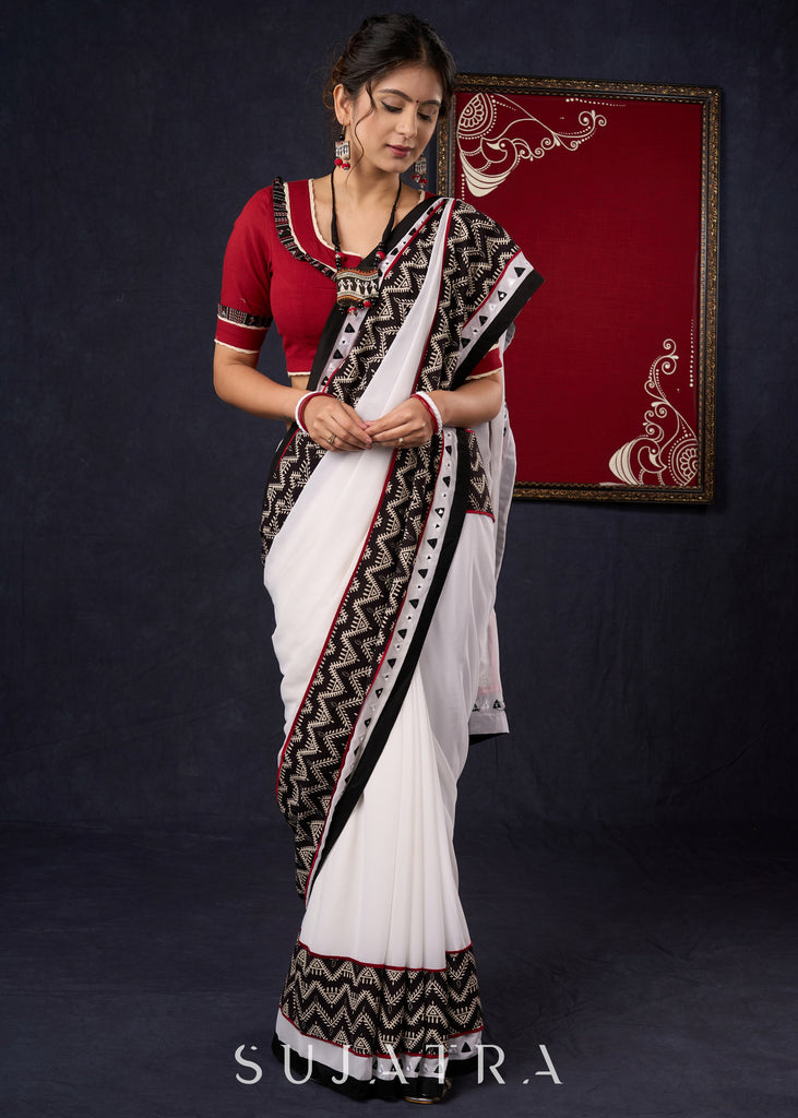 Exclusive Georgette saree with Ajrakh borders & Intricate Hand Embroidered highlights