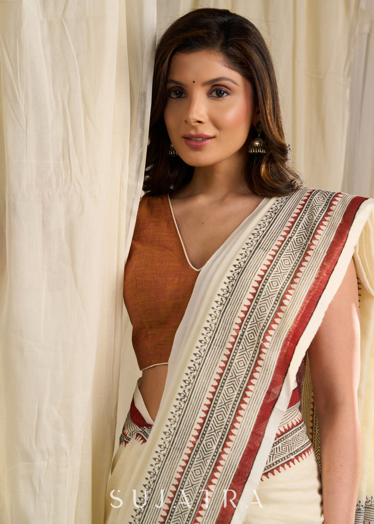 Ethereal off-white saree adorned with exquisite hand block prints and intricate artwork