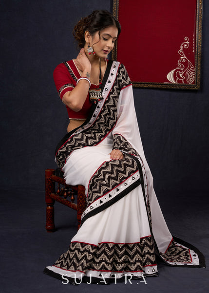 Exclusive Georgette saree with Ajrakh borders & Intricate Hand Embroidered highlights