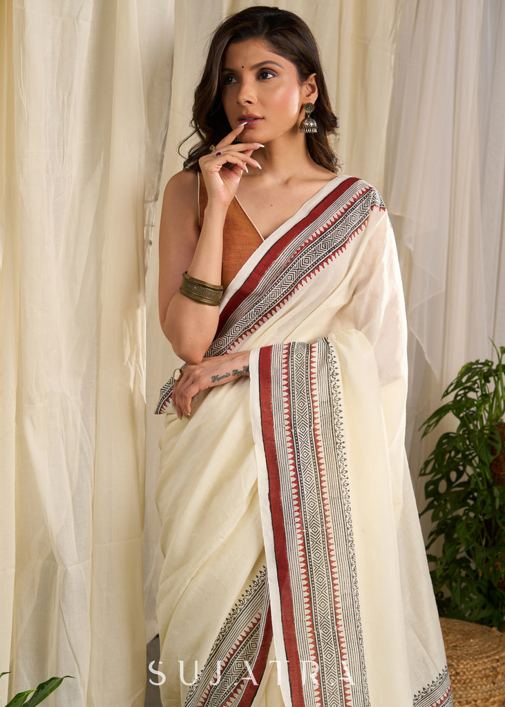 Ethereal off-white saree adorned with exquisite hand block prints and intricate artwork