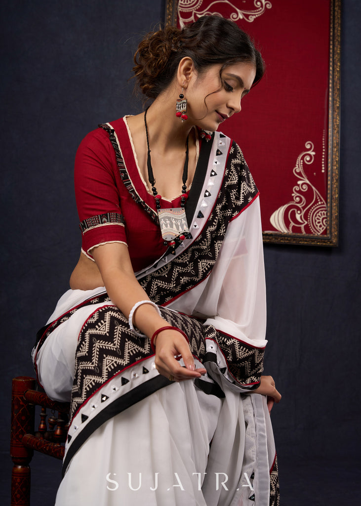 Exclusive Georgette saree with Ajrakh borders & Intricate Hand Embroidered highlights