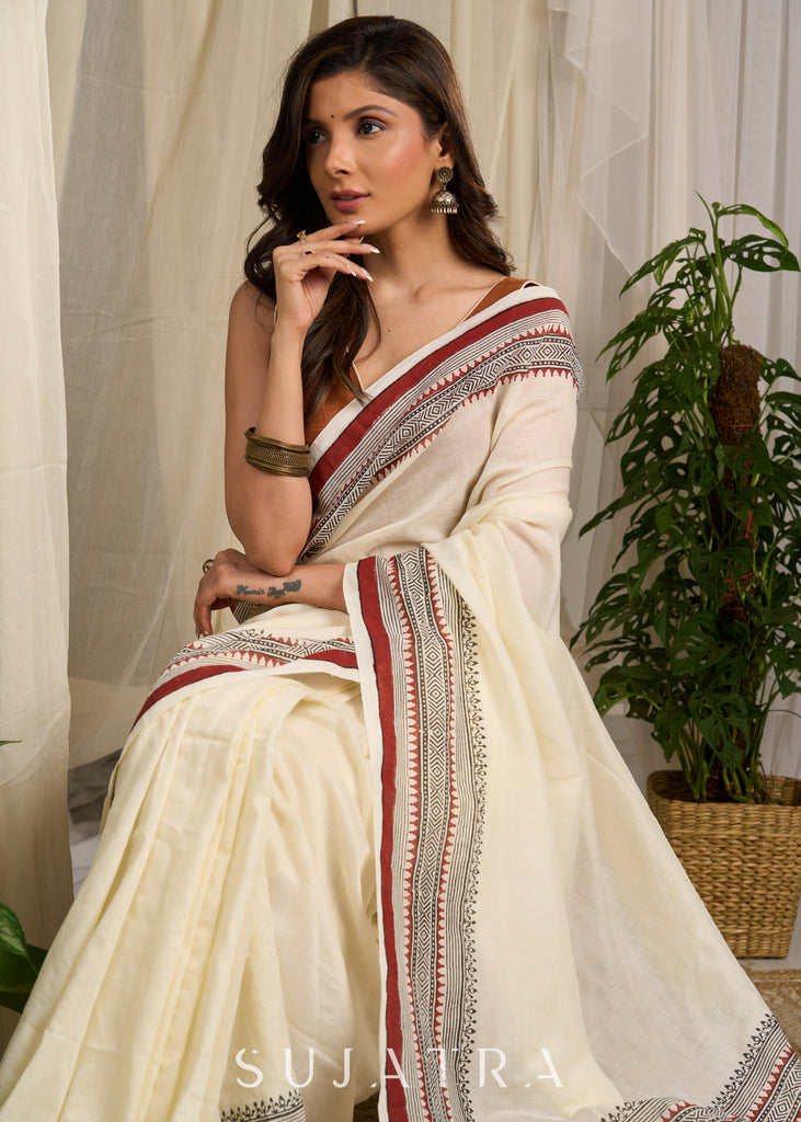 Ethereal off-white saree adorned with exquisite hand block prints and intricate artwork