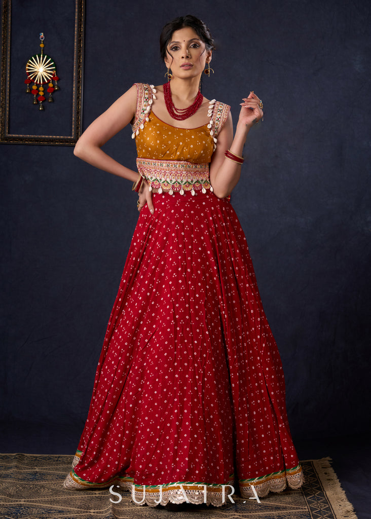 Beautiful Red Bandhani Lehenga With Mustard Embroidered Blouse & Matching Dupatta.