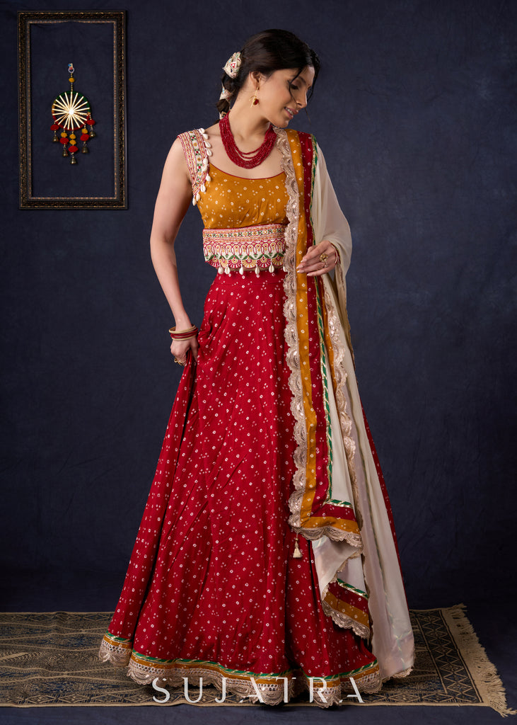 Beautiful Red Bandhani Lehenga With Mustard Embroidered Blouse & Matching Dupatta.