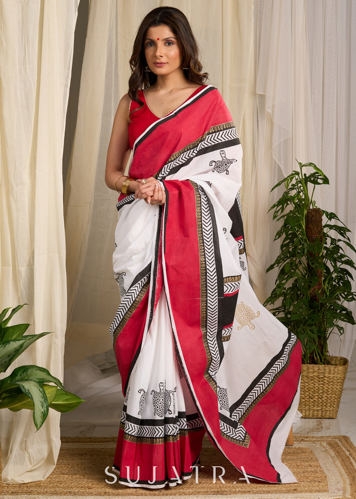 Elegant red & white saree adorned with intricate turtle block prints