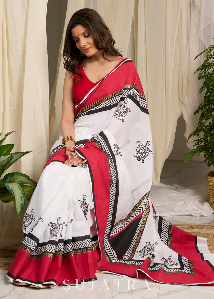 Elegant red & white saree adorned with intricate turtle block prints