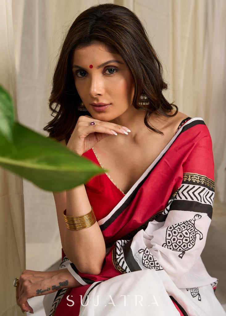 Elegant red & white saree adorned with intricate turtle block prints