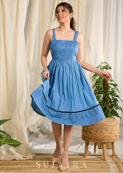 Flowy blue cotton dress with intricate block print and artistic detailing