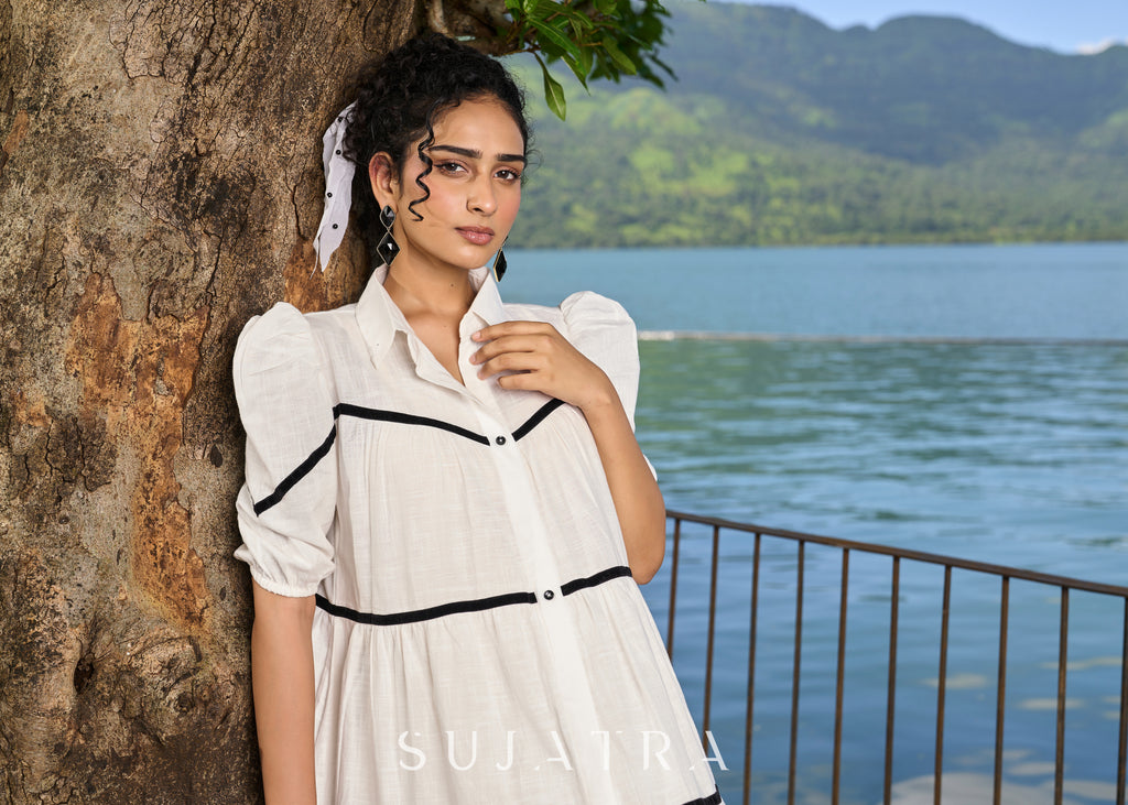 Graceful white cotton flared one piece dress highlighted with velvet lace