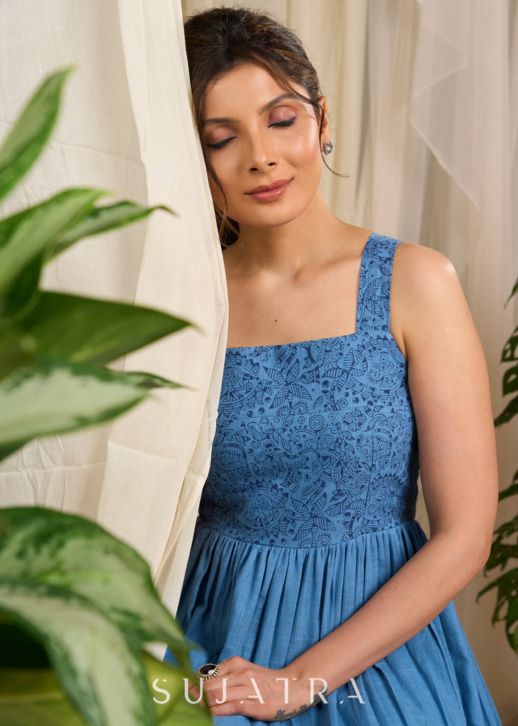 Flowy blue cotton dress with intricate block print and artistic detailing