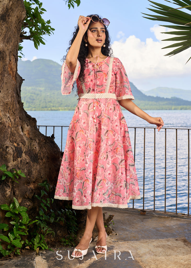 Beautiful light pink chanderi floral printed dress highlighted with macrame lace