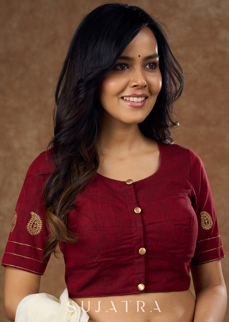 Real elegance : Maroon cotton blouse featuring intricate phaisley embroidery perfect for making a sophisticated statement