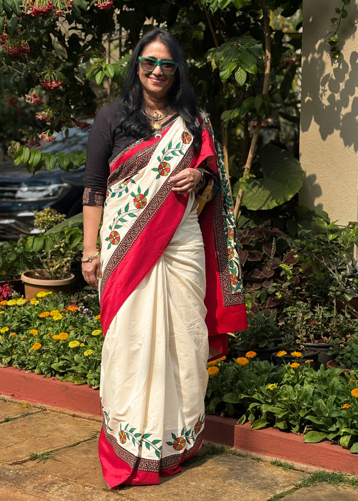 Beautiful Off-white saree with Hand-Painted Madhubani Pallu Highlighted with Ajrakh Border & Painted Floral Motifs