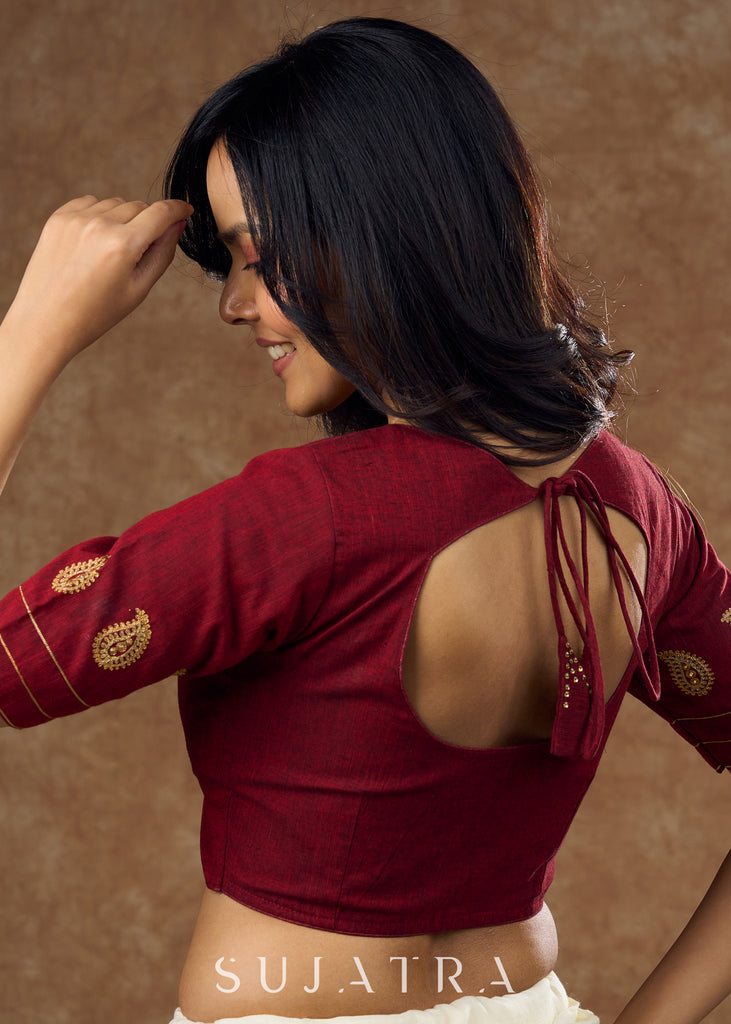 Real elegance : Maroon cotton blouse featuring intricate phaisley embroidery perfect for making a sophisticated statement