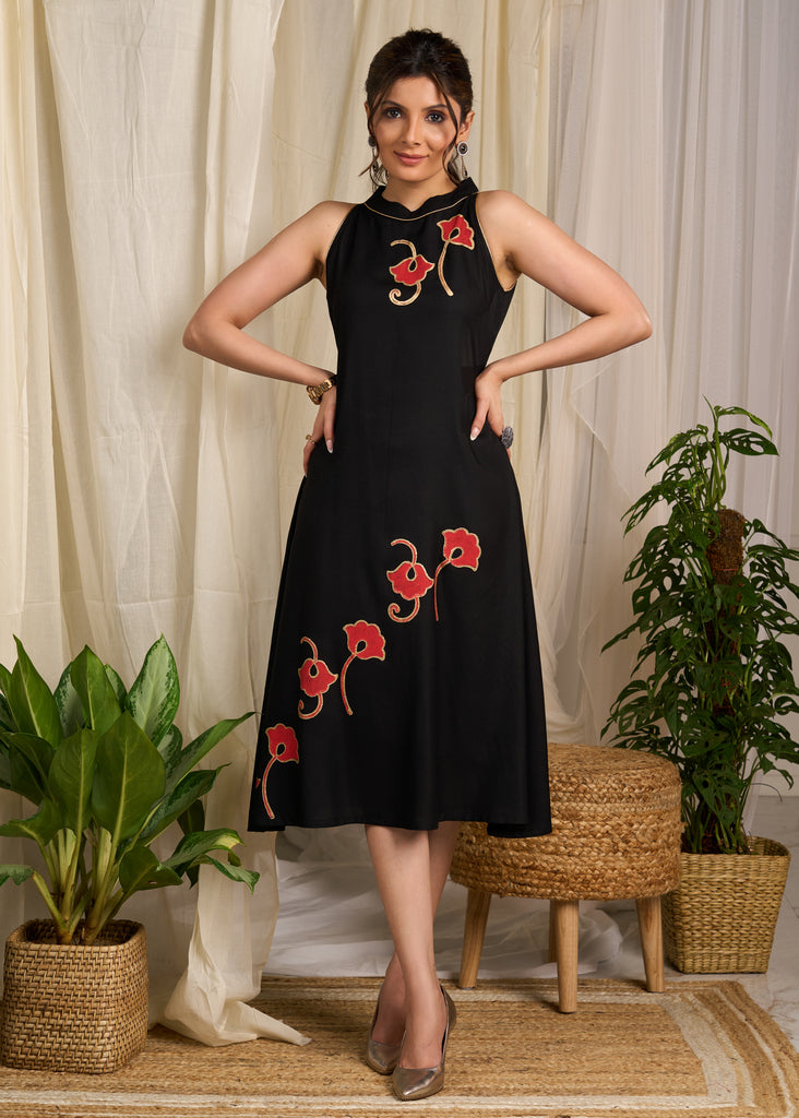 Stunning black rayon dress adorned with vibrant floral block print accents