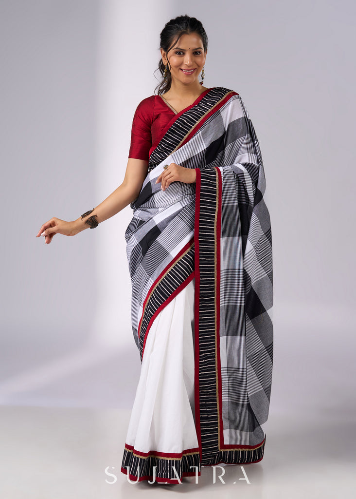 Classy white cotton saree with bold checks & red-black borders