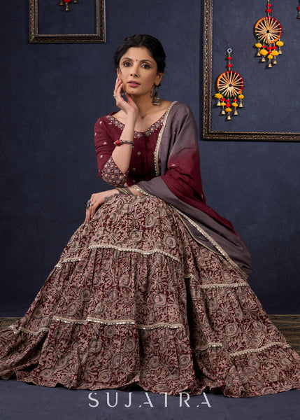 Exclusive Wine Kalamkari Tiered Lehenga With Embroidered Blouse & Shaded Dupatta.