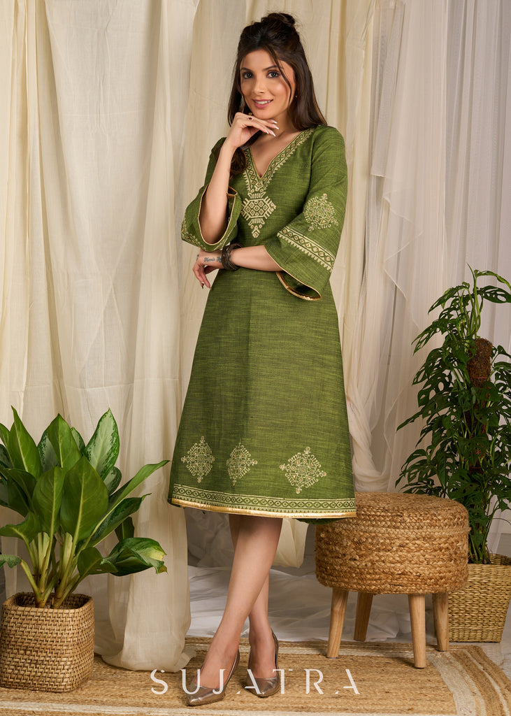 Graceful green cotton dress showcasing exquisite block print and artistic handcrafted detailing