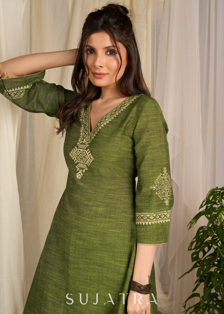 Graceful green cotton dress showcasing exquisite block print and artistic handcrafted detailing