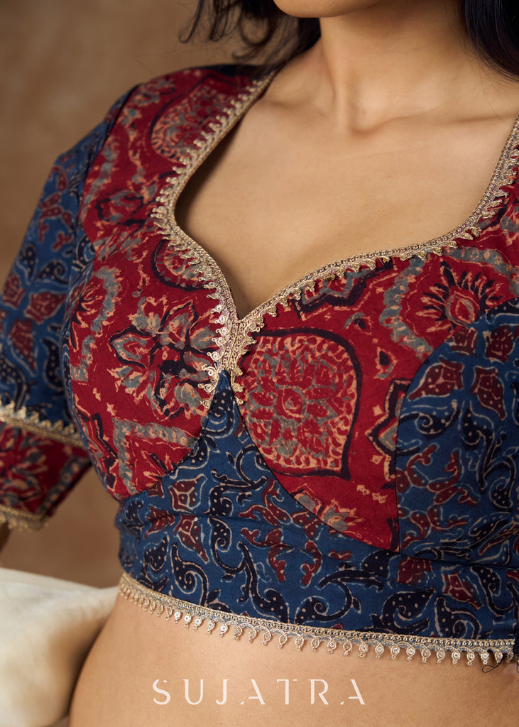 Evergreen maroon & blue Ajrakh blouse with lace work .