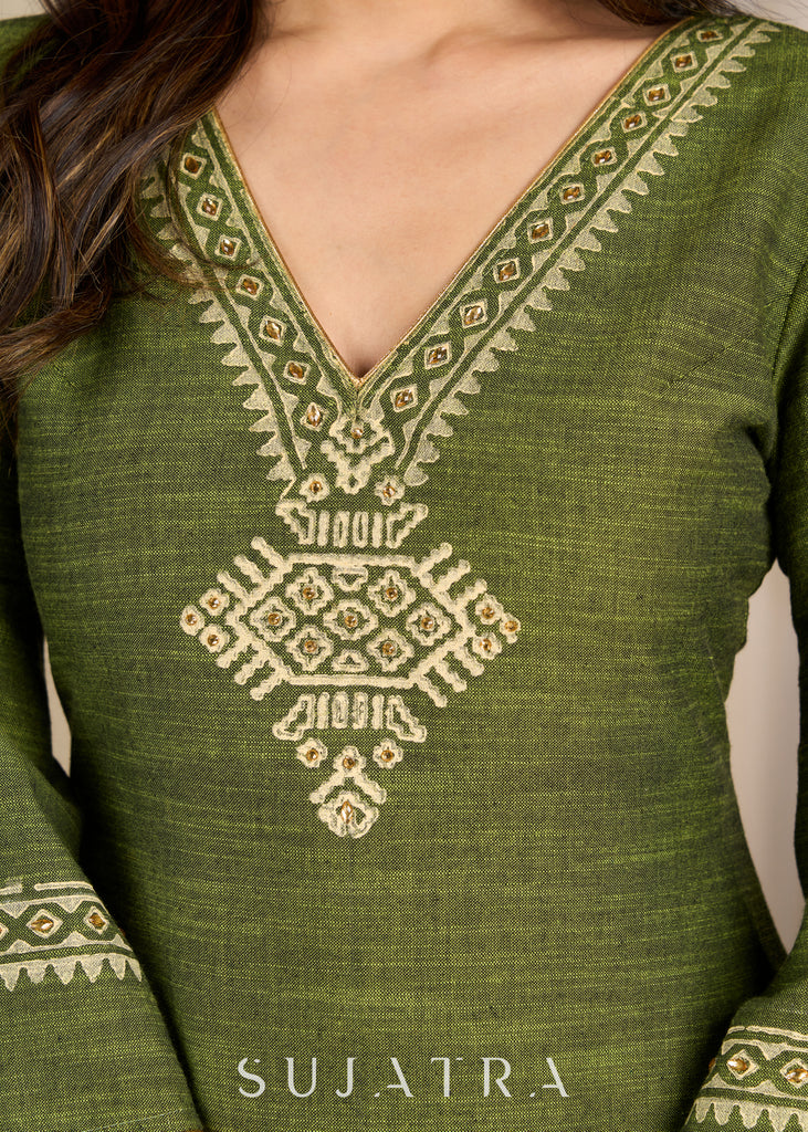 Graceful green cotton dress showcasing exquisite block print and artistic handcrafted detailing