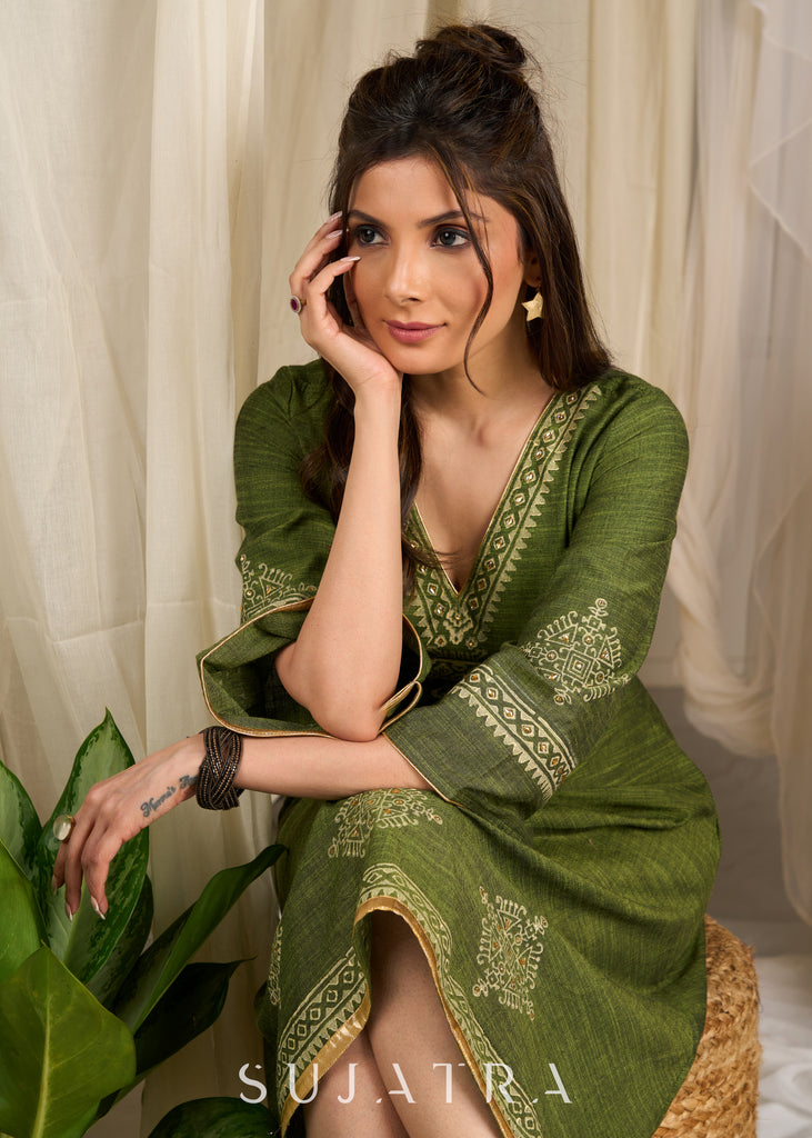 Graceful green cotton dress showcasing exquisite block print and artistic handcrafted detailing