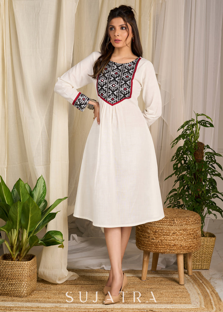 Elegant ivory dress featuring bold block print artistry with geometric charm