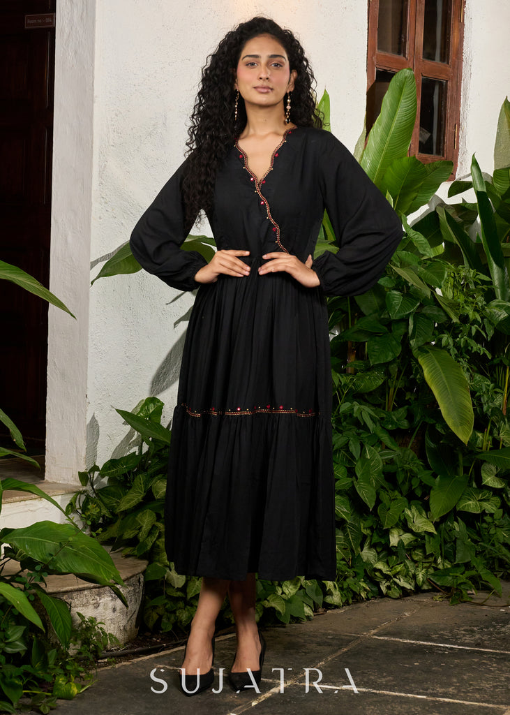 Trendy black rayon gathered one piece dress highlighted with minimal embroidery