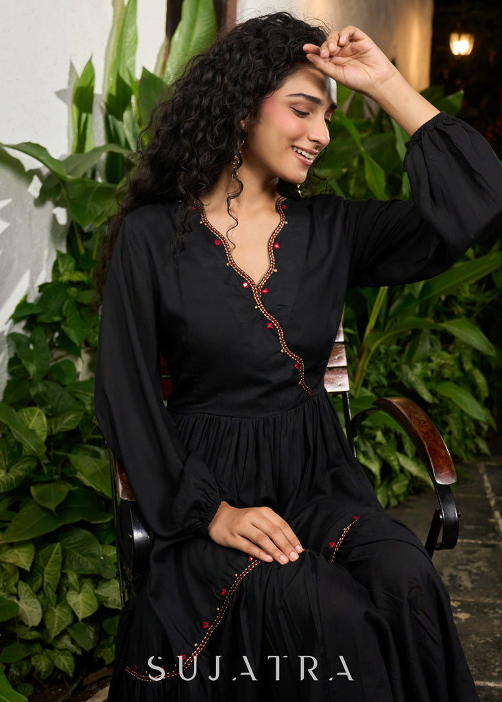 Trendy black rayon gathered one piece dress highlighted with minimal embroidery