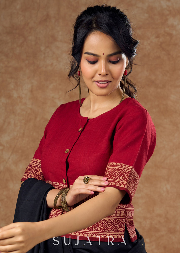 A unique blend of maroon cotton and traditional Ajrakh print in this top style blouse  is perfect for eclectic touch to any outfit .