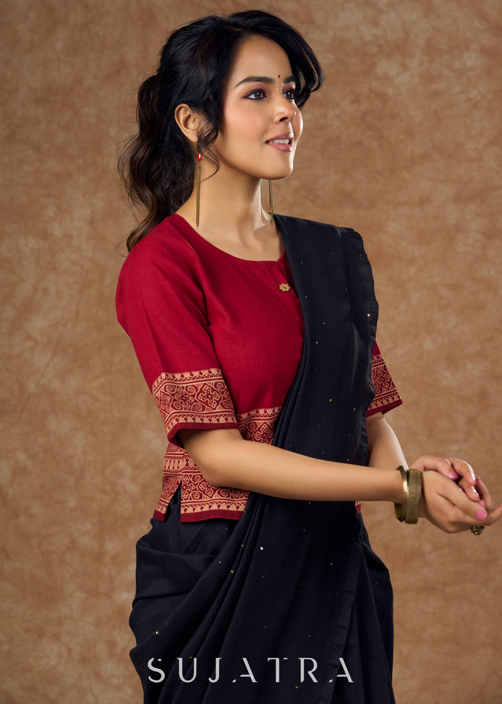 A unique blend of maroon cotton and traditional Ajrakh print in this top style blouse  is perfect for eclectic touch to any outfit .