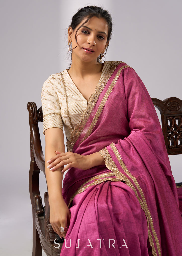 Rich pink cotton saree with golden zari and delicate design