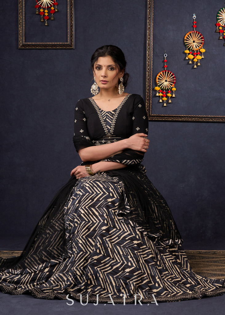 Elegant Black Printed Lehenga With Embroidered Blouse & Net Dupatta.