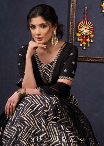 Elegant Black Printed Lehenga With Embroidered Blouse & Net Dupatta.