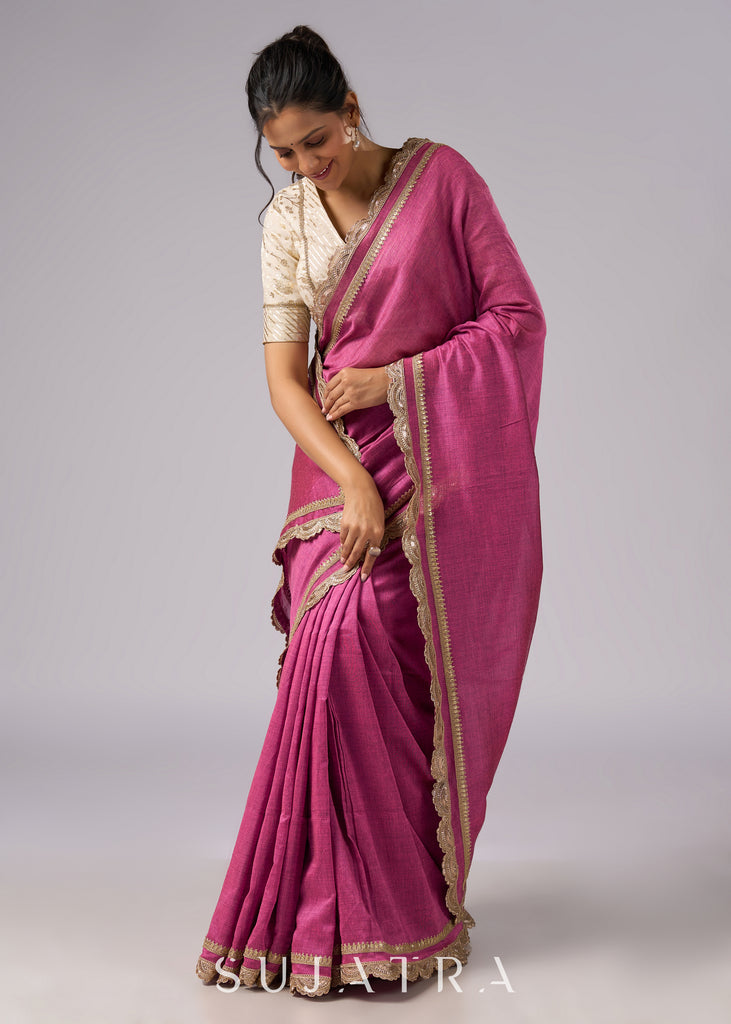 Rich pink cotton saree with golden zari and delicate design