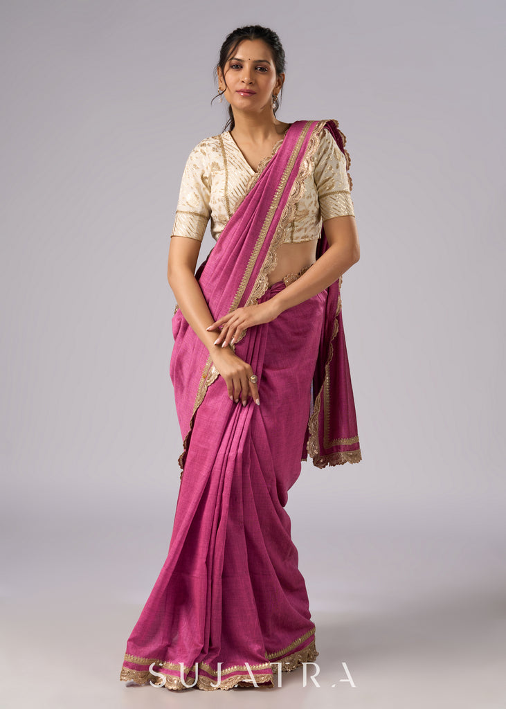 Rich pink cotton saree with golden zari and delicate design