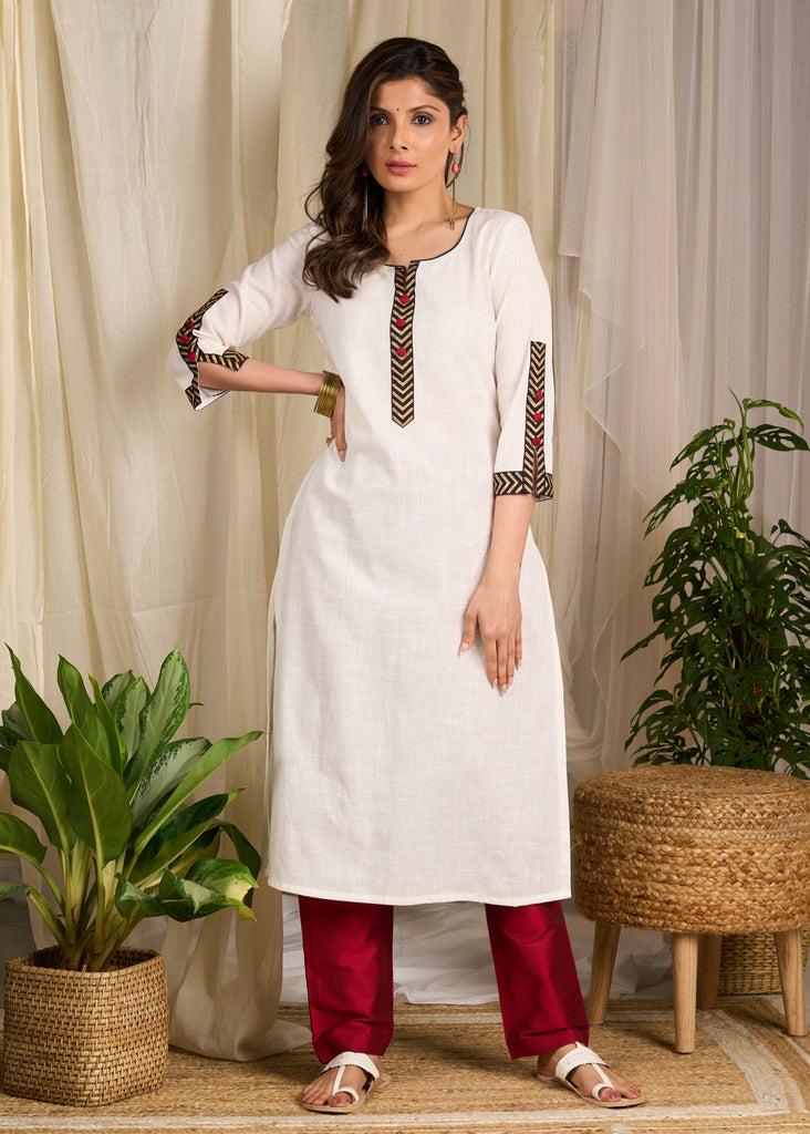 Graceful white cotton kurta with bold chevron block prints and intricate detailing