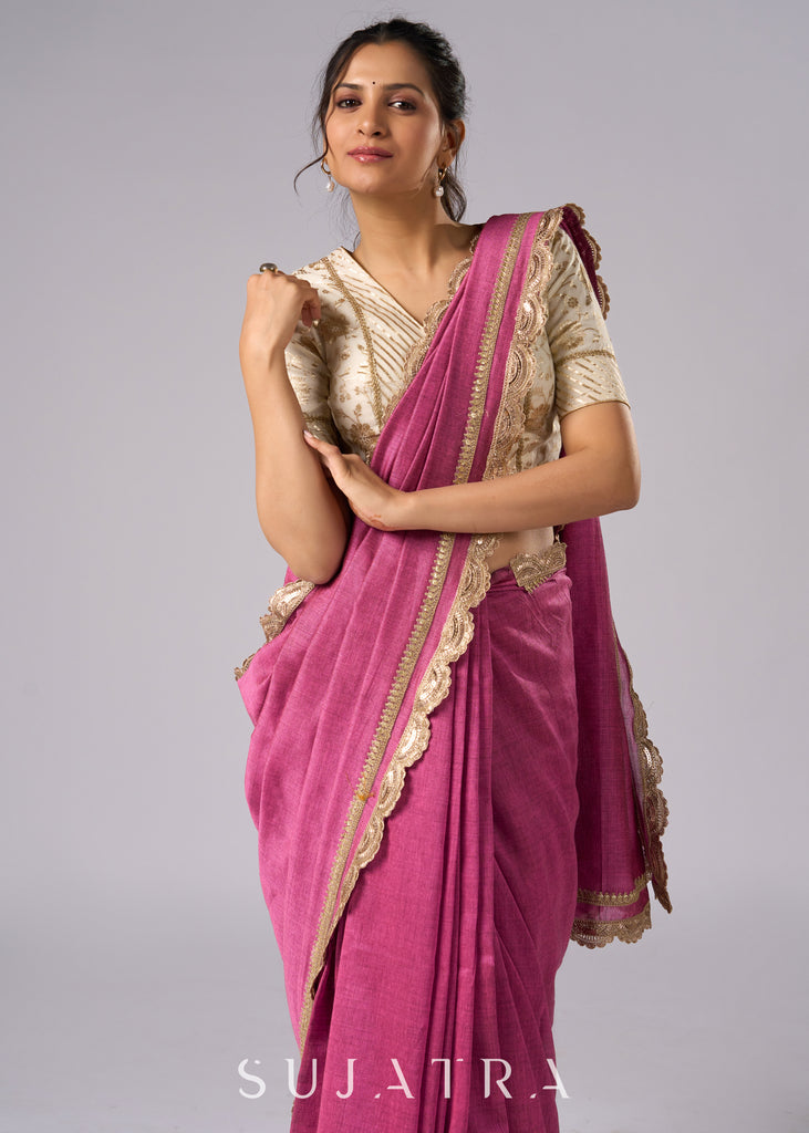 Rich pink cotton saree with golden zari and delicate design