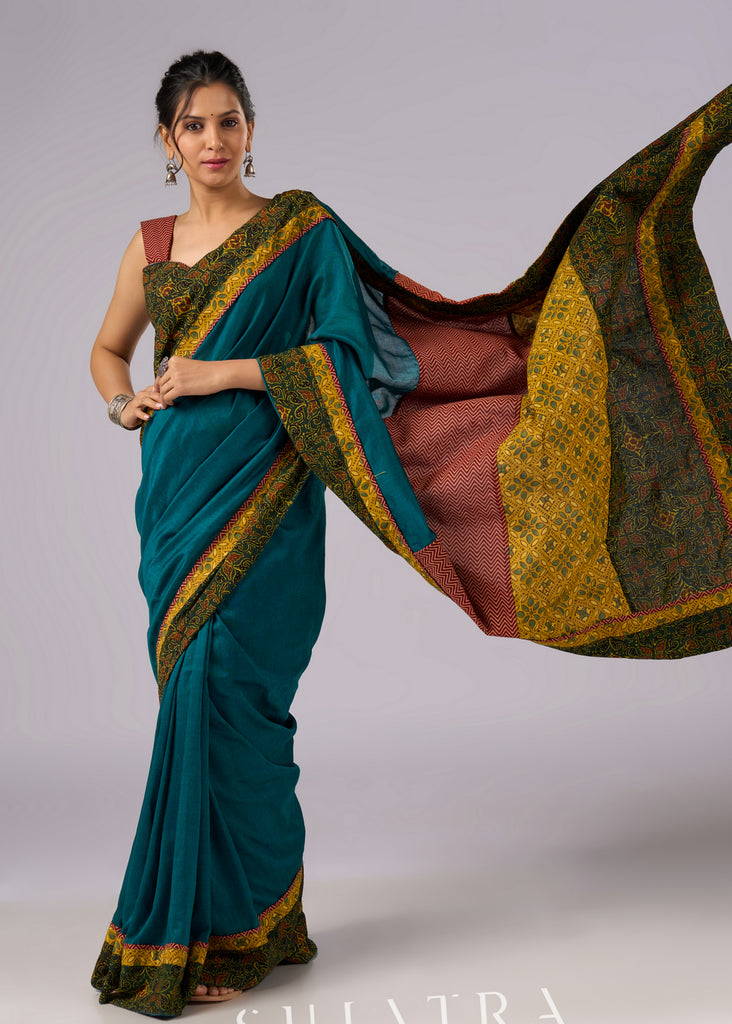 Exclusive green cotton saree with Ajrakh patchwork border