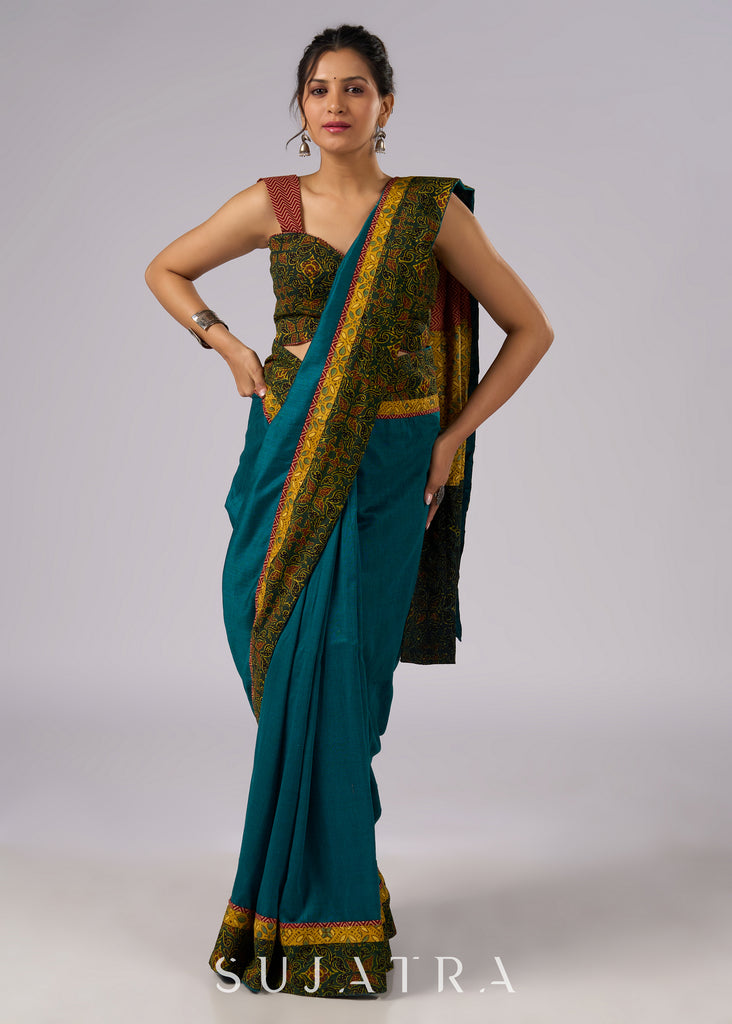 Exclusive green cotton saree with Ajrakh patchwork border