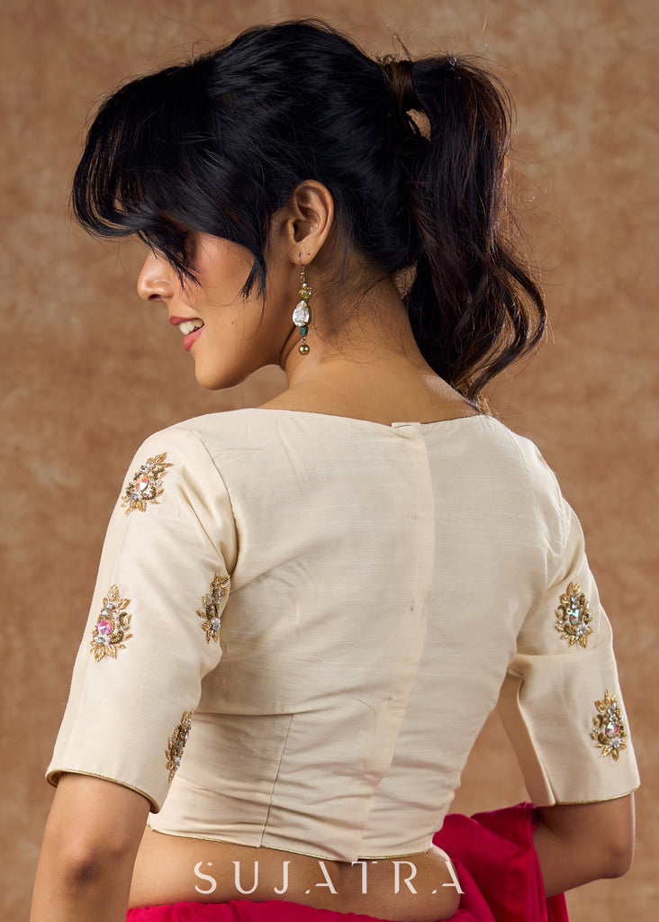 Elevate your ethnic style with this beautiful cream cotton silk blouse showcasing beautiful zardosi work .