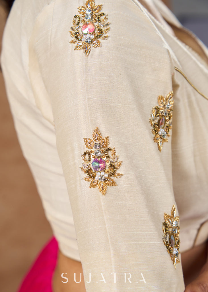 Elevate your ethnic style with this beautiful cream cotton silk blouse showcasing beautiful zardosi work .