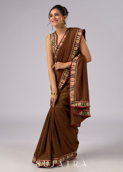 Elegant two tone brown saree with delicate floral patterns and zari detalining