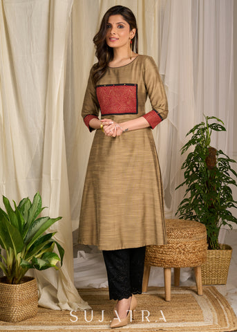 Golden cotton silk kurta featuring bold block print accents & intricate artwork detailing