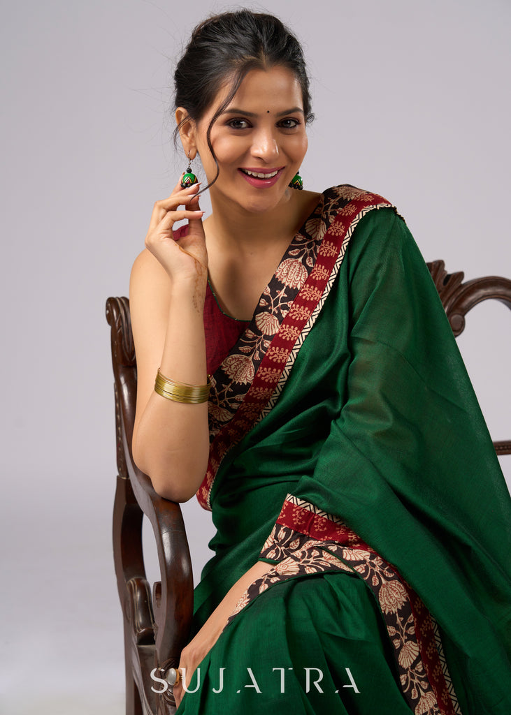 Stunning green cotton saree with beige and red floral Ajrakh accents