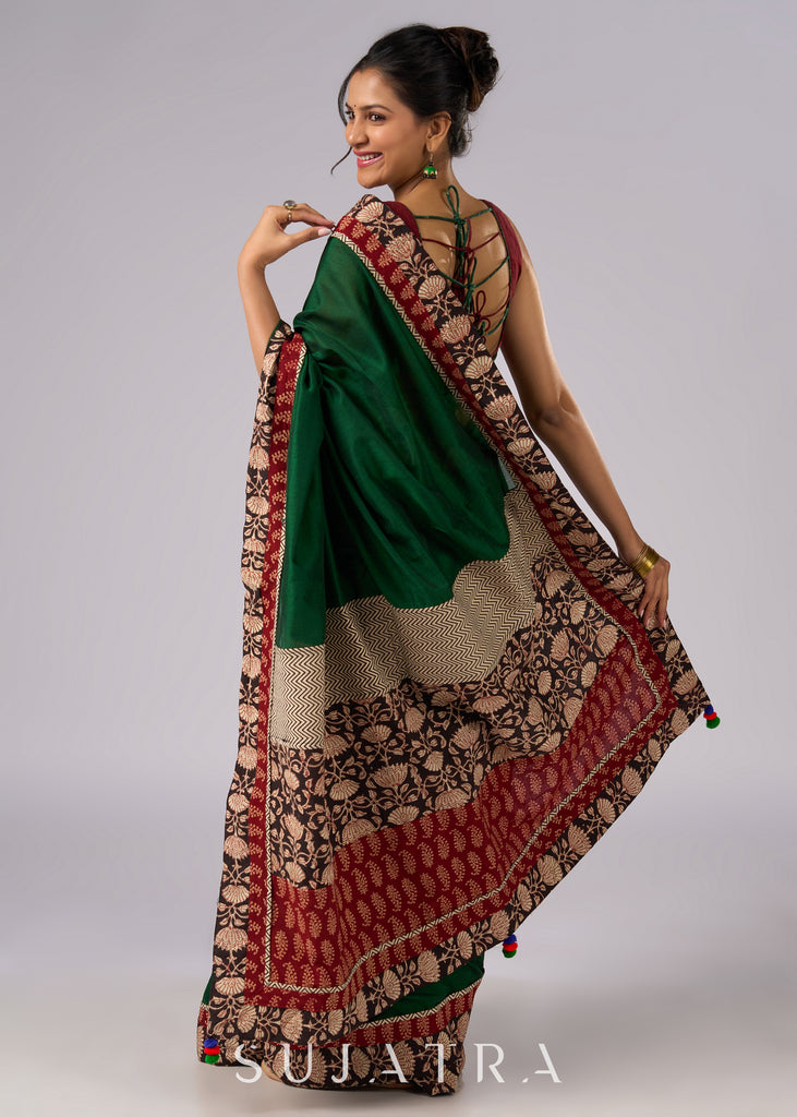 Stunning green cotton saree with beige and red floral Ajrakh accents