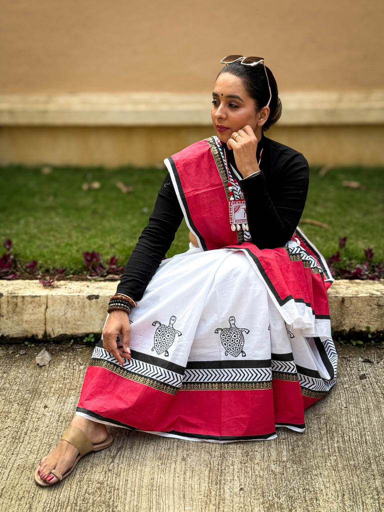 Elegant red & white saree adorned with intricate turtle block prints