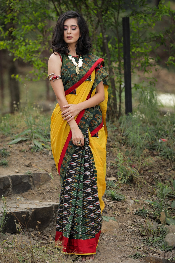 Combination of yellow handloom cotton, block printed Ajrakh border & Ikat pleats saree with ghungroos tassels