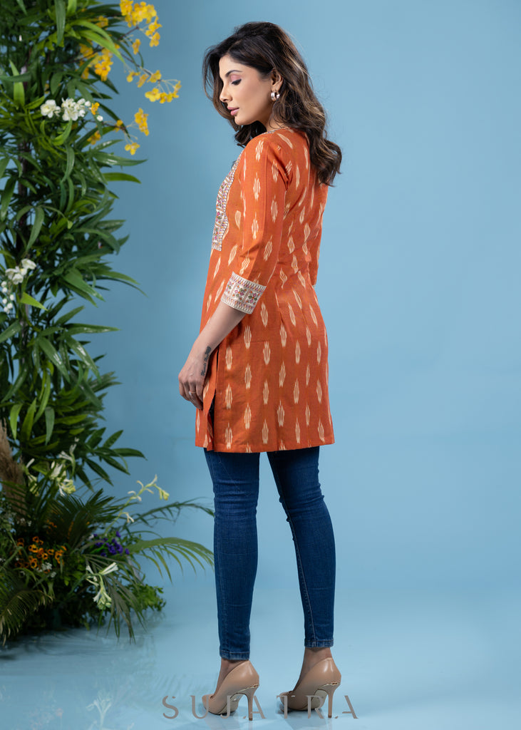 Graceful orange cotton ikat tunic with madhubani combination