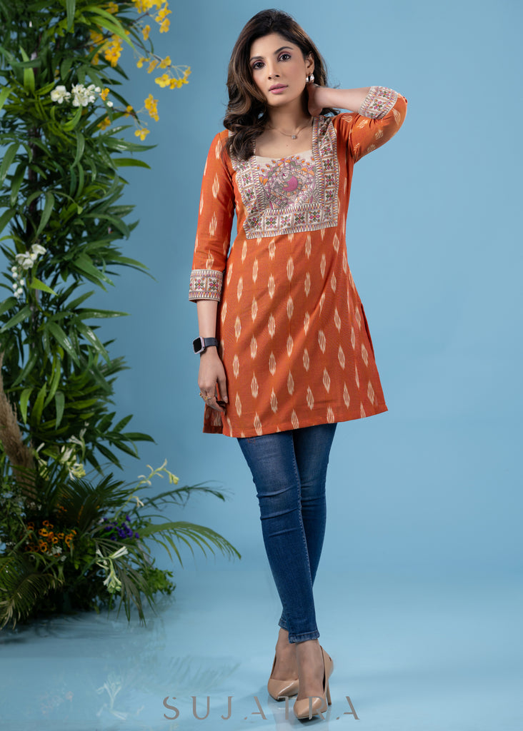 Graceful orange cotton ikat tunic with madhubani combination